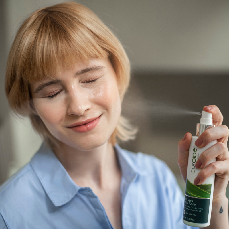 Woman using a Curaloe product
